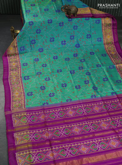 Rajkot patola silk saree dual shade of teal green and purple with allover ikat weaves and ikat woven zari border