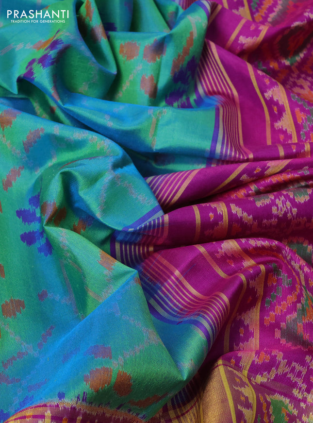 Rajkot patola silk saree dual shade of teal green and purple with allover ikat weaves and ikat woven zari border