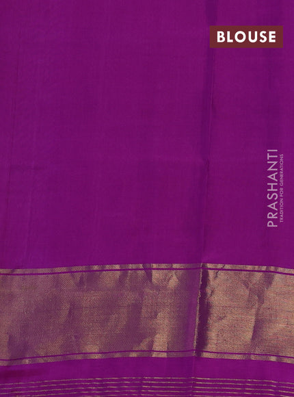 Rajkot patola silk saree dual shade of teal green and purple with allover ikat weaves and ikat woven zari border