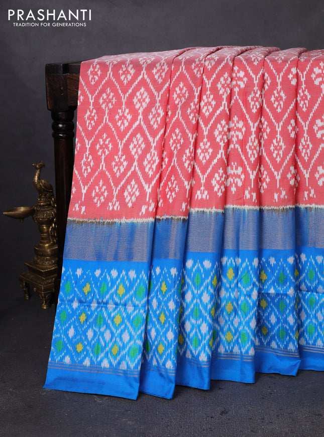Pochampally silk saree peach orange and cs blue with allover ikat weaves and long ikat woven zari border