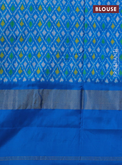 Pochampally silk saree peach orange and cs blue with allover ikat weaves and long ikat woven zari border