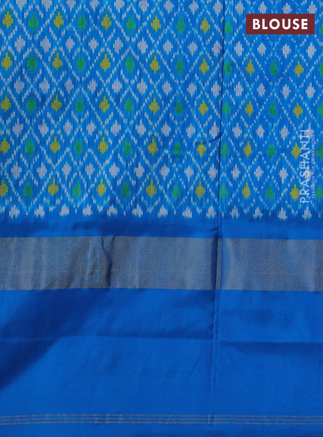 Pochampally silk saree peach orange and cs blue with allover ikat weaves and long ikat woven zari border