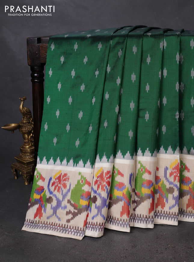 Pochampally silk saree green and cream with ikat butta weaves and ikat woven zari border