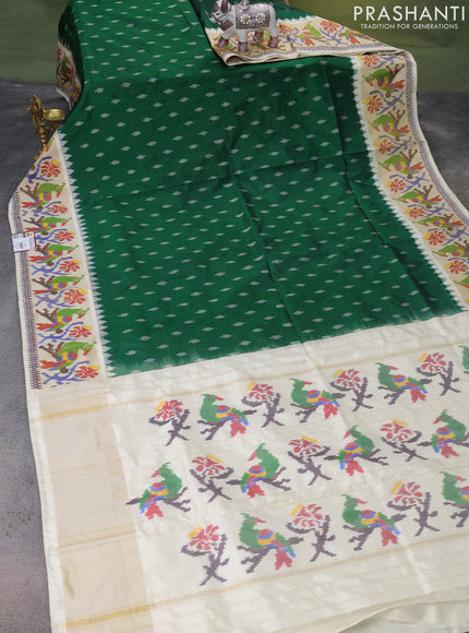 Pochampally silk saree green and cream with ikat butta weaves and ikat woven zari border