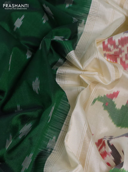 Pochampally silk saree green and cream with ikat butta weaves and ikat woven zari border