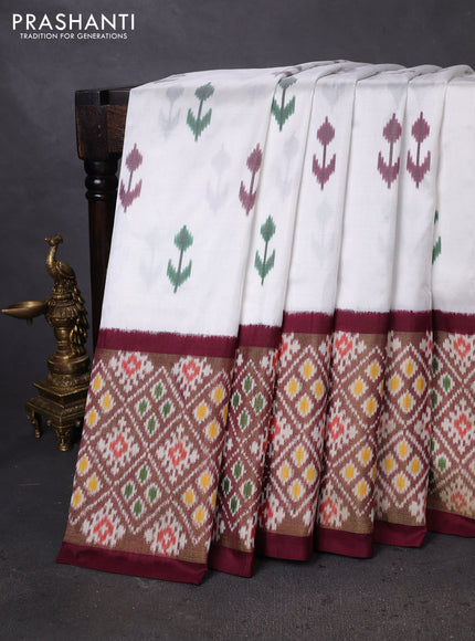 Pochampally silk saree off white and wine shade with ikat butta weaves and long ikat woven border
