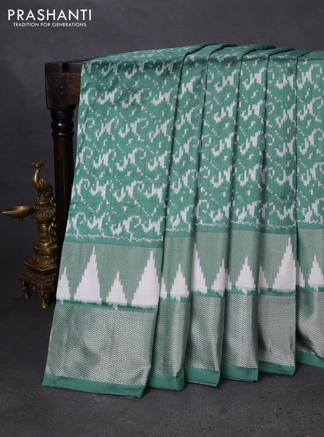 Pochampally silk saree pastel green with allover ikat weaves and silver zari woven border