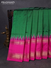 Pochampally silk saree green and pink with plain body and temple design zari woven border
