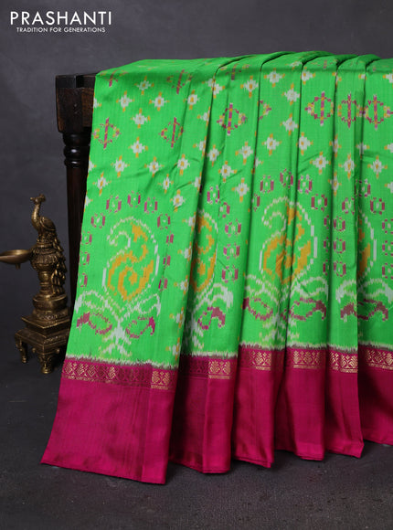 Pochampally silk saree parrot green and magenta pink with allover ikat weaves and zari woven simple border