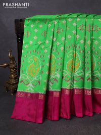 Pochampally silk saree parrot green and magenta pink with allover ikat weaves and zari woven simple border
