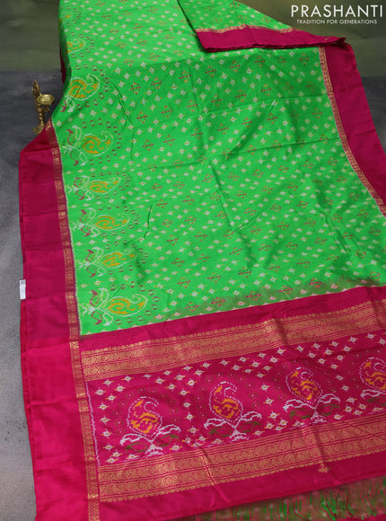 Pochampally silk saree parrot green and magenta pink with allover ikat weaves and zari woven simple border