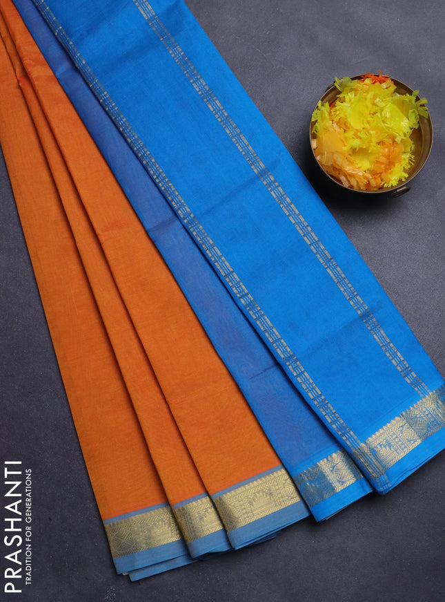 Silk Cotton saree orange and cs blue with plain body and zari woven border