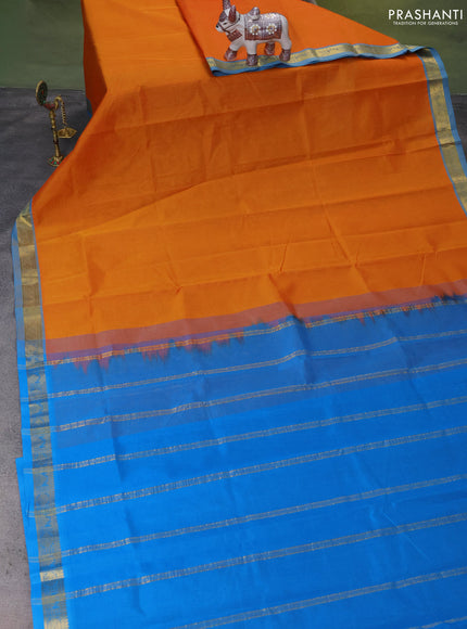 Silk Cotton saree orange and cs blue with plain body and zari woven border