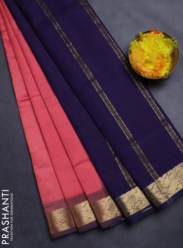 Silk Cotton saree peach pink and navy blue with plain body and zari woven border
