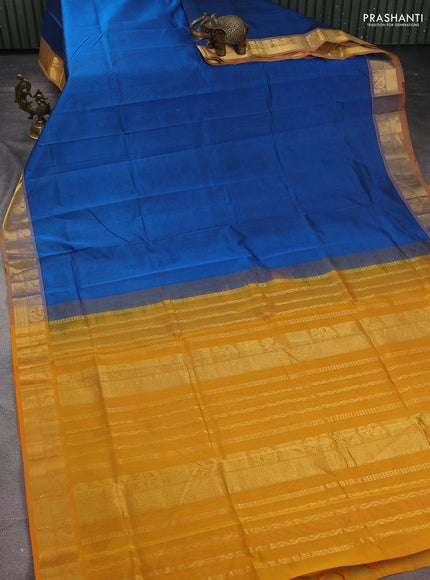Silk Cotton saree cs ble and mustard yellow with plain body and zari woven border
