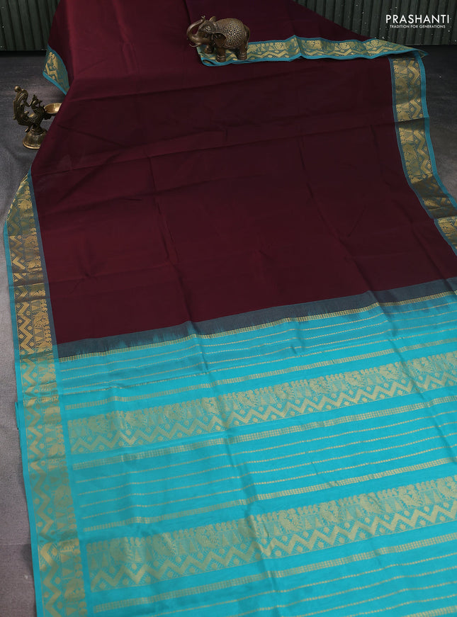 Silk Cotton saree deep maroon and teal blue with plain body and zari woven border