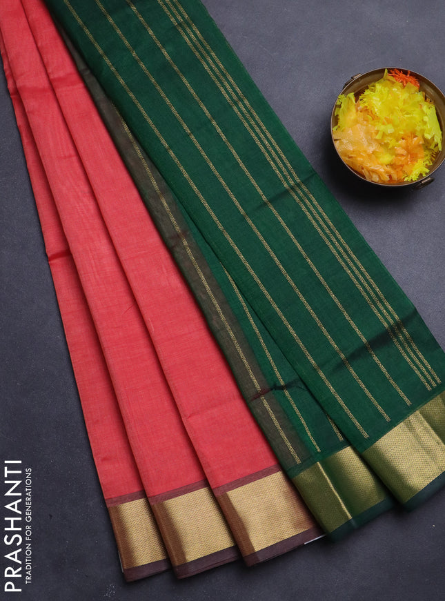Silk Cotton saree peach pink and green with plain body and zari woven border