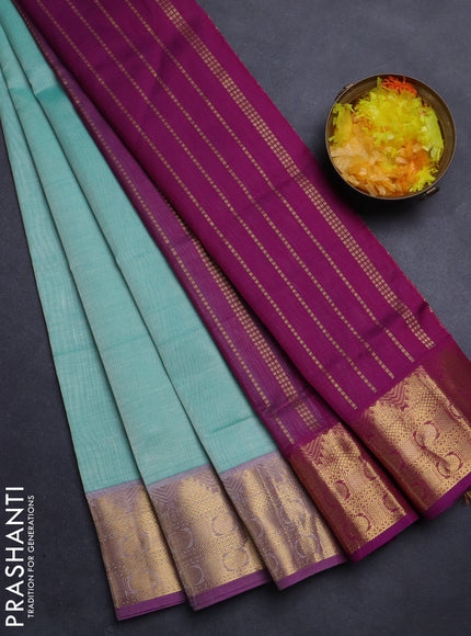 Silk Cotton saree teal blue and purple with plain body and zari woven border