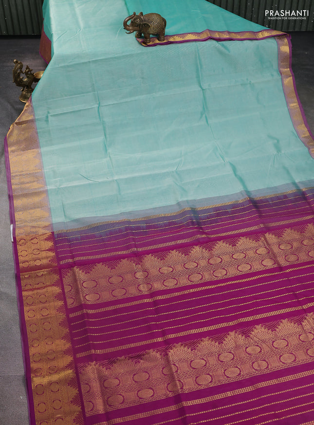 Silk Cotton saree teal blue and purple with plain body and zari woven border