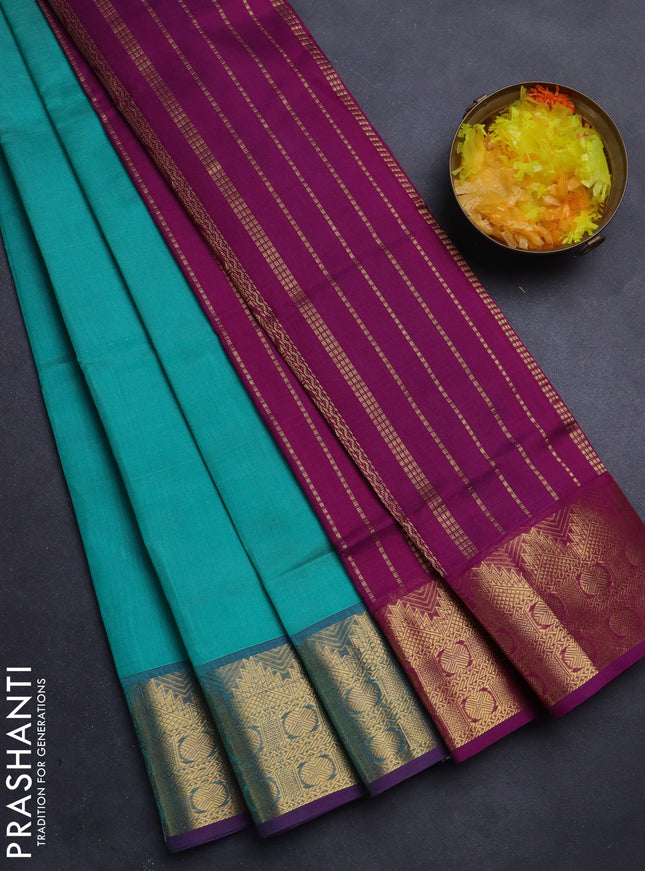 Silk Cotton saree teal blue and purple with plain body and zari woven border