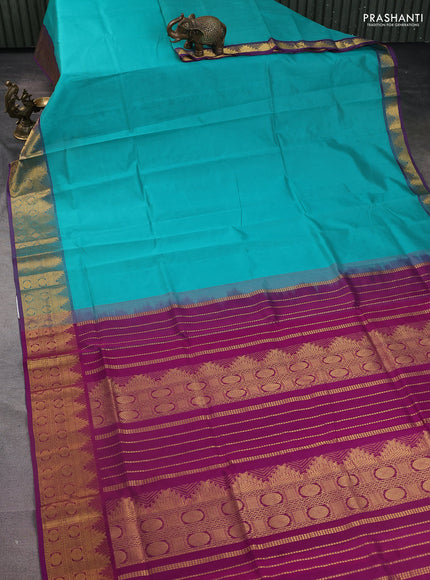 Silk Cotton saree teal blue and purple with plain body and zari woven border