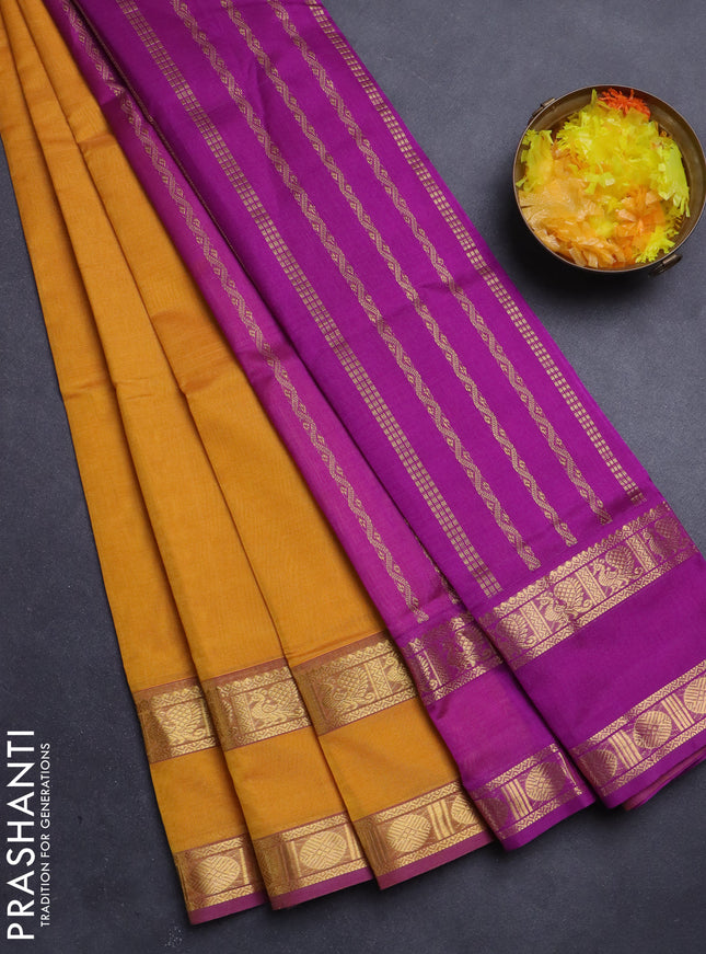 Silk Cotton saree mustard yellow and purple with plain body and rettapet zari woven border