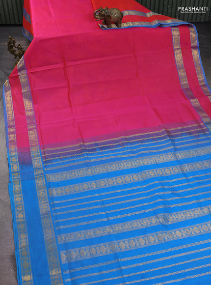 Silk Cotton saree dual shade of pinkish orange and cs blue with plain body and rettapet zari woven border