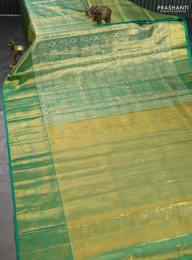 Pure kanchipuram tissue silk saree green shade with allover zari woven brocade weaves and zari woven border