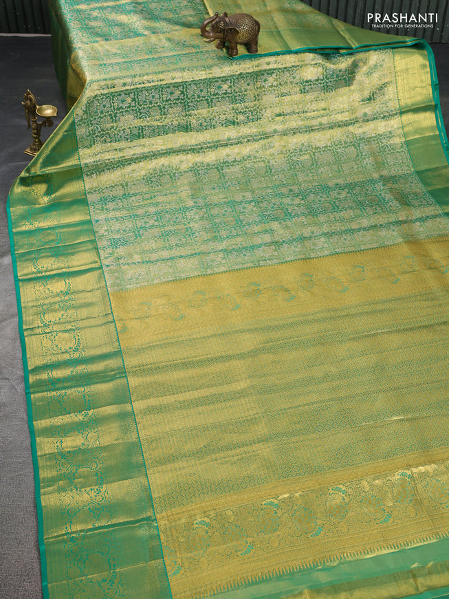 Pure kanchipuram tissue silk saree green shade with allover zari woven brocade weaves and zari woven border