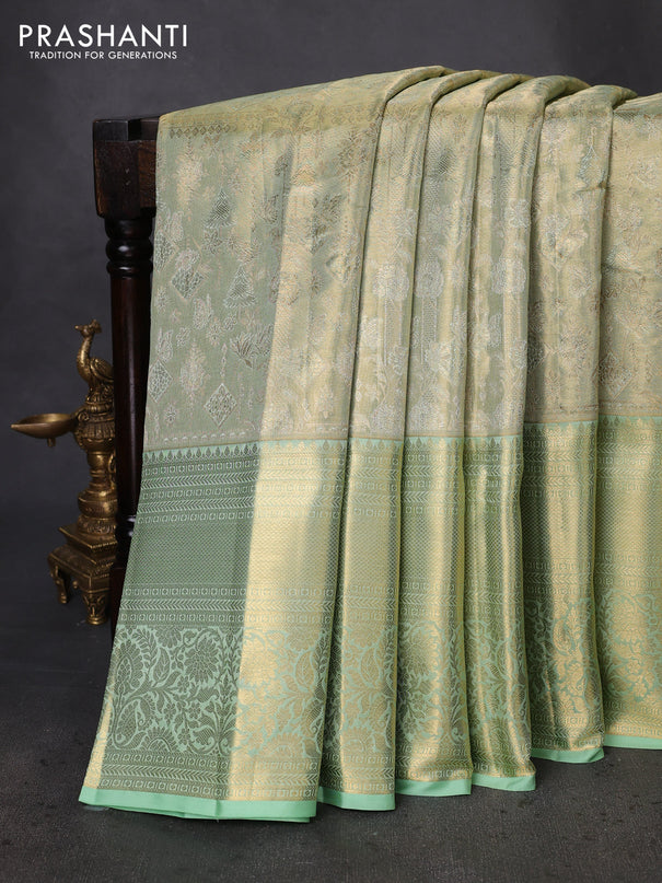 Pure kanchipuram tissue silk saree pista green with allover zari woven brocade weaves and zari woven border