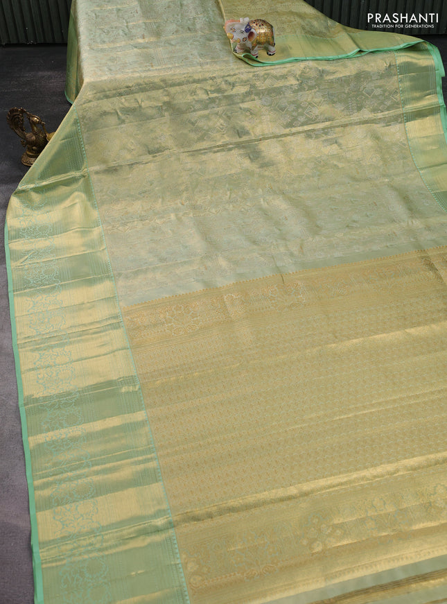 Pure kanchipuram tissue silk saree pista green with allover zari woven brocade weaves and zari woven border