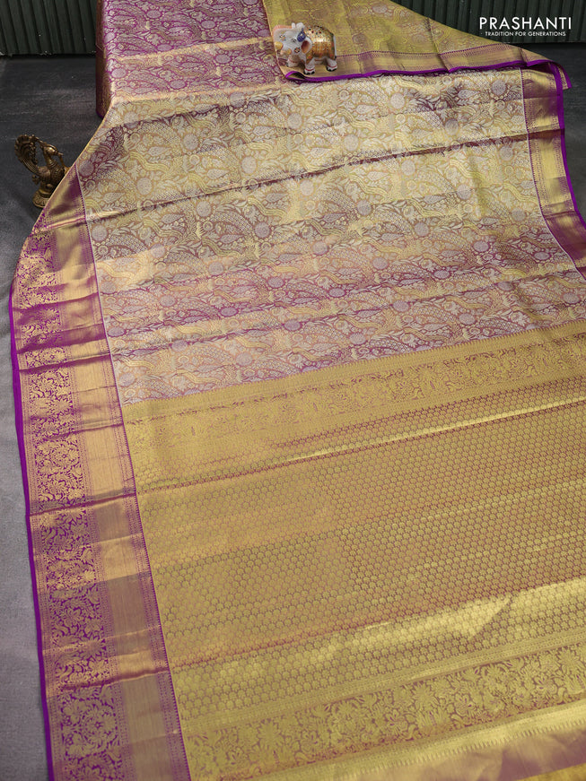 Pure kanchipuram tissue silk saree dual shade of gold and purple with allover zari woven brocade weaves and zari woven border