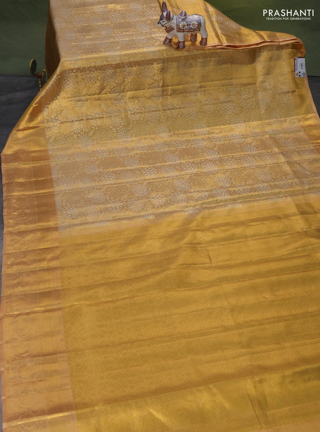 Pure kanchipuram tissue silk saree sandal with allover zari woven brocade weaves and zari woven border