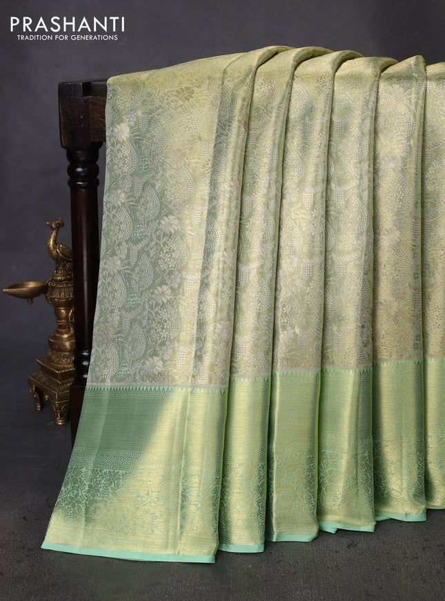 Pure kanchipuram tissue silk saree pista green with allover zari woven brocade weaves and zari woven border