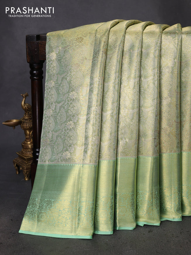 Pure kanchipuram tissue silk saree pista green with allover zari woven brocade weaves and zari woven border