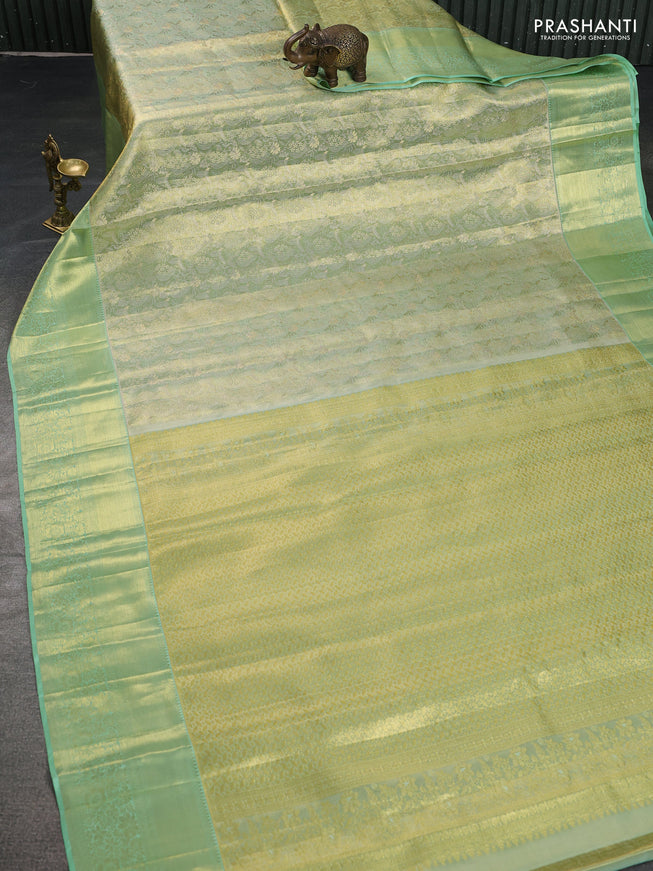 Pure kanchipuram tissue silk saree pista green with allover zari woven brocade weaves and zari woven border