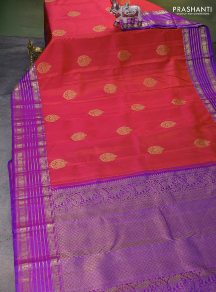 Pure kanchipuram silk saree dual shade of pinkish orange and purple with zari woven buttas and rich zari woven border