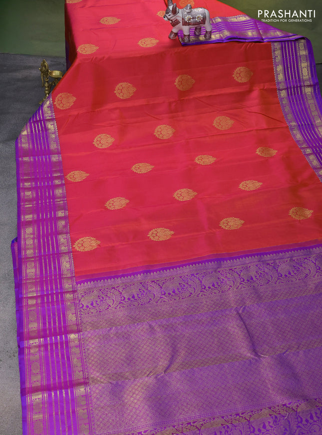 Pure kanchipuram silk saree dual shade of pinkish orange and purple with zari woven buttas and rich zari woven border