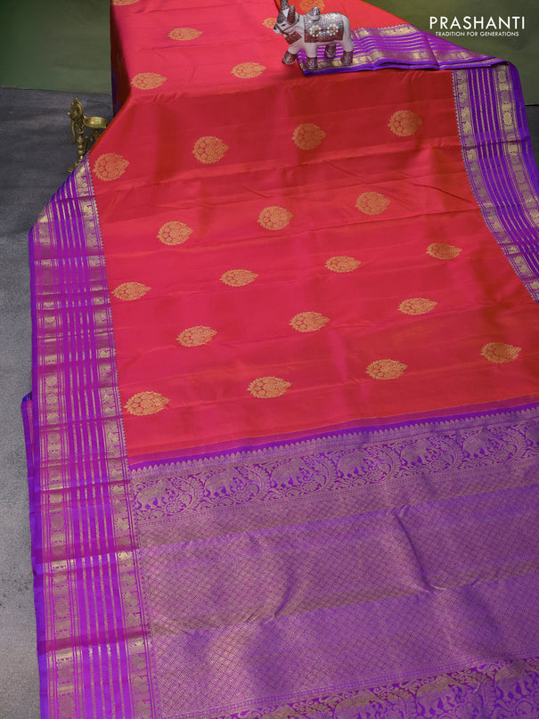 Pure kanchipuram silk saree dual shade of pinkish orange and purple with zari woven buttas and rich zari woven border