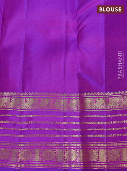 Pure kanchipuram silk saree dual shade of pinkish orange and purple with zari woven buttas and rich zari woven border