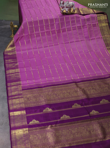 Pure kanchipuram silk saree lavender and purple with allover zari woven strip pattern and rich zari woven border