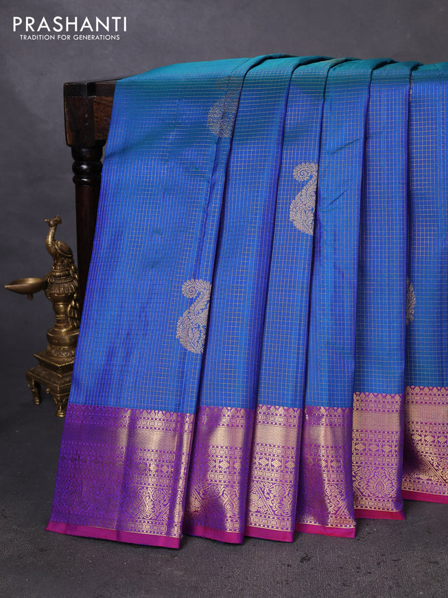 Pure kanchipuram silk saree dual shade of bluish green and purple with allover zari checks & paisley buttas and rich zari woven border
