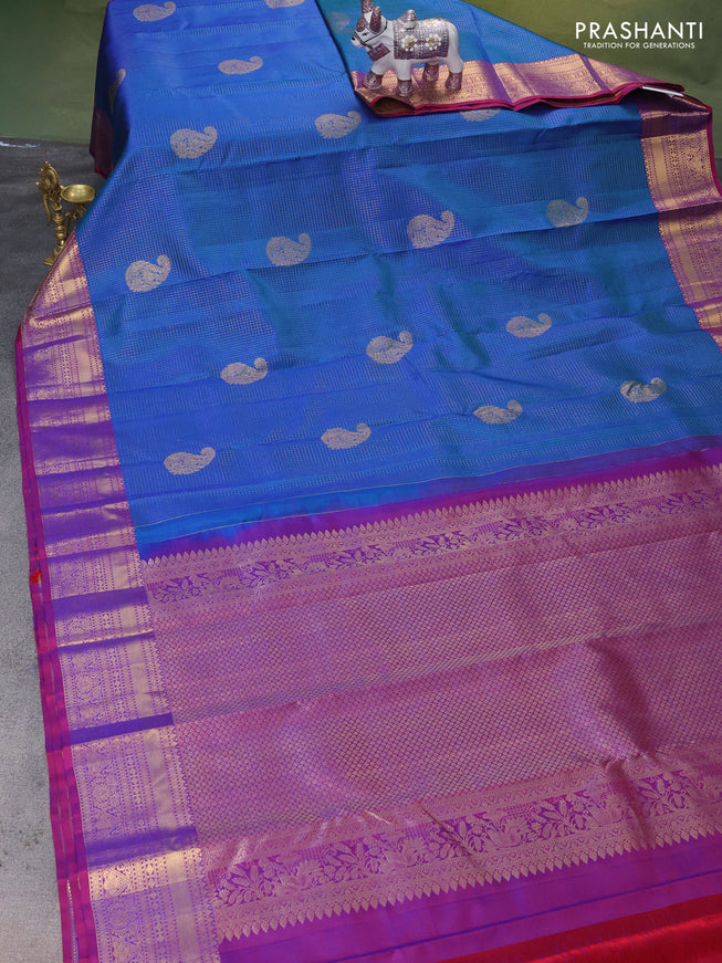 Pure kanchipuram silk saree dual shade of bluish green and purple with allover zari checks & paisley buttas and rich zari woven border
