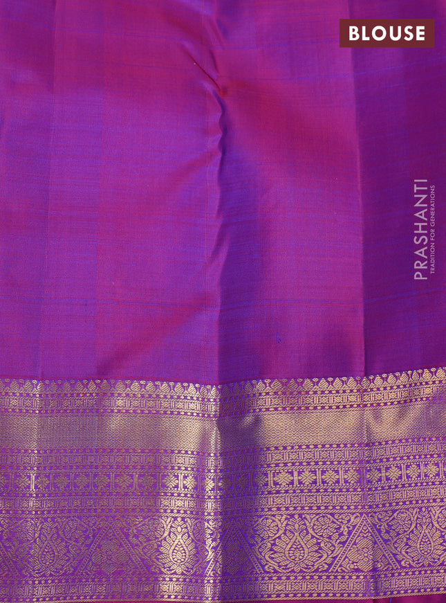 Pure kanchipuram silk saree dual shade of bluish green and purple with allover zari checks & paisley buttas and rich zari woven border