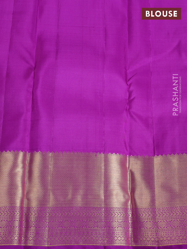 Pure kanchipuram silk saree dual shade of purplish green and purple with allover zari checks & buttas and zari woven border