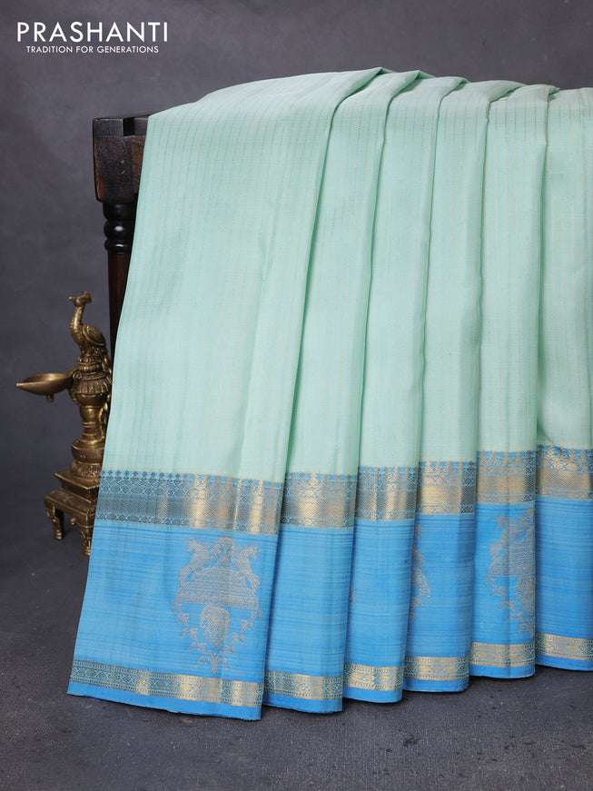 Pure kanchipuram silk saree teal shade and blue with allover zari woven strip pattern and rettapet zari woven butta border