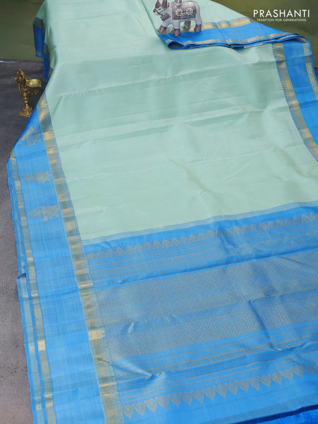 Pure kanchipuram silk saree teal shade and blue with allover zari woven strip pattern and rettapet zari woven butta border