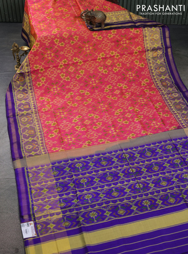 Rajkot patola silk saree dual shade of pinkish orange and blue with allover ikat weaves and ikat woven border