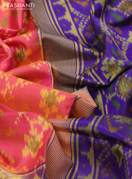 Rajkot patola silk saree dual shade of pinkish orange and blue with allover ikat weaves and ikat woven border