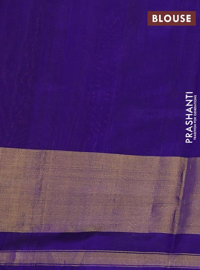 Rajkot patola silk saree dual shade of pinkish orange and blue with allover ikat weaves and ikat woven border